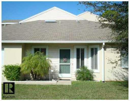 6980 Ulmerton Road, Unit 7F Largo, FL 33771 - Photo 1 of 1 front view of a house with a yard