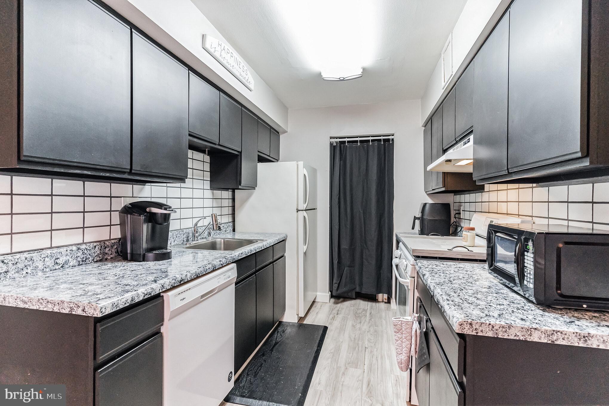 7015 Ridge Avenue, Unit 2 Philadelphia, PA 19128 - Photo 8 of 19 Kitchen w/pantry & laundry