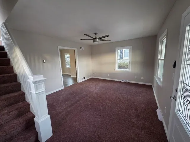 wooden floor in an empty room with a fireplace