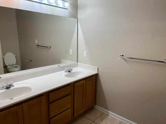 a bathroom with a sink and mirror