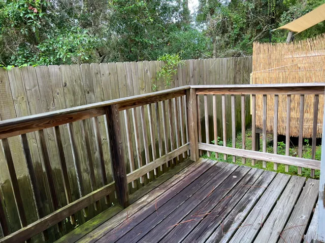 a view of wooden balcony with outdoor space