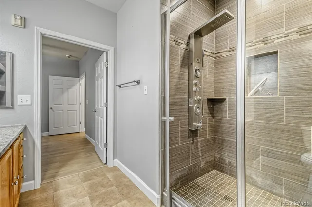 a bathroom with a shower and a sink