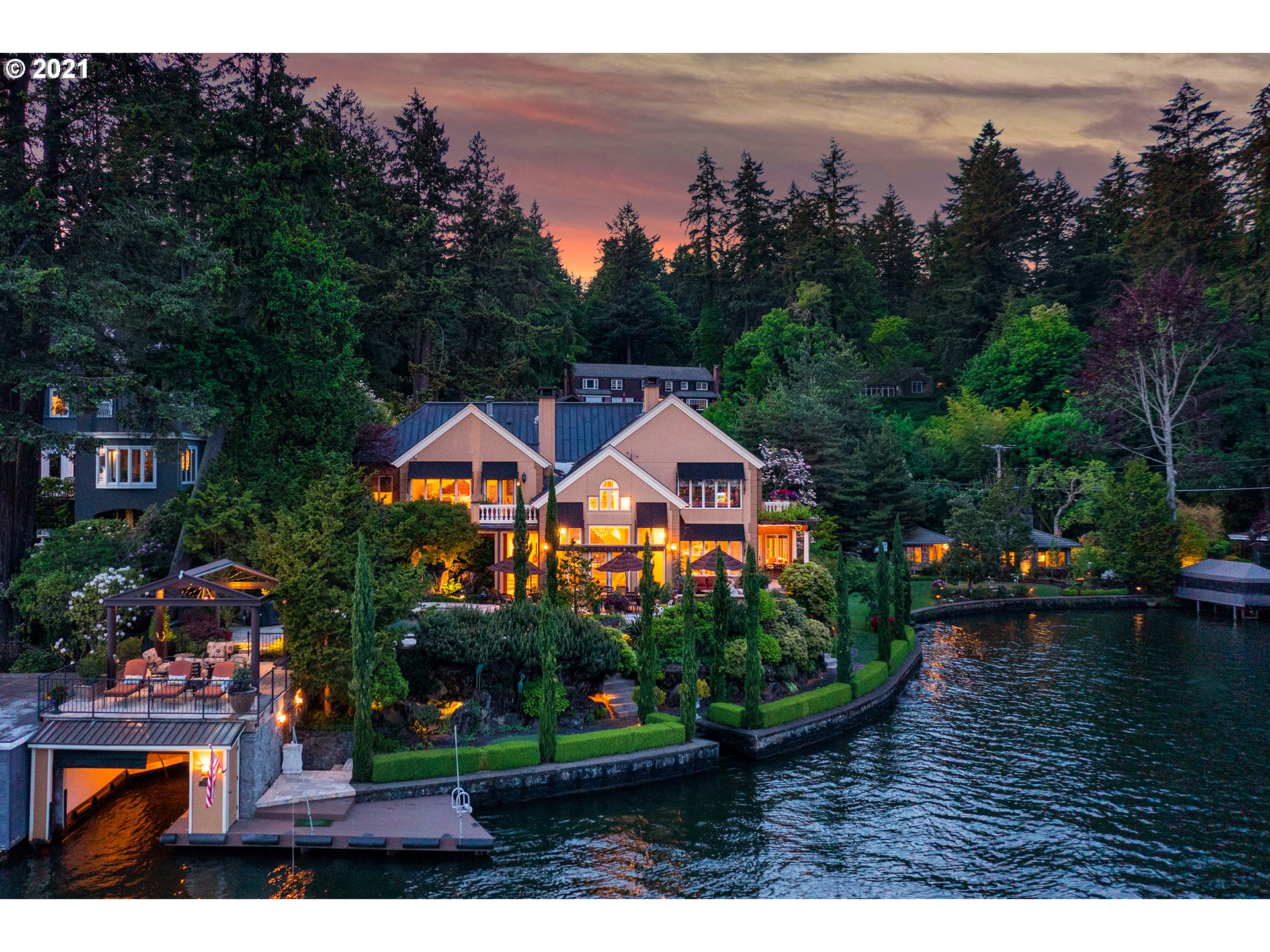 a aerial view of a house with garden space and outdoor seating