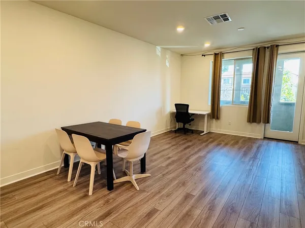 a large bed sitting in a bedroom next to a small yard