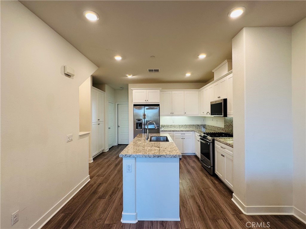 2626 Glamis Court Arcadia, CA 91007 - Photo 22 of 68 a kitchen with sink refrigerator stove and microwave