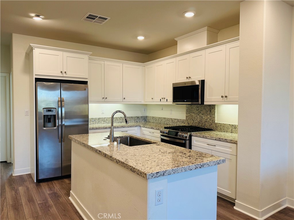 2626 Glamis Court Arcadia, CA 91007 - Photo 23 of 68 a kitchen with stainless steel appliances granite countertop a sink stove and refrigerator