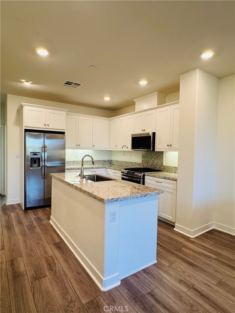 2626 Glamis Court Arcadia, CA 91007 - Photo 24 of 68 a kitchen with stainless steel appliances granite countertop a sink stove and refrigerator