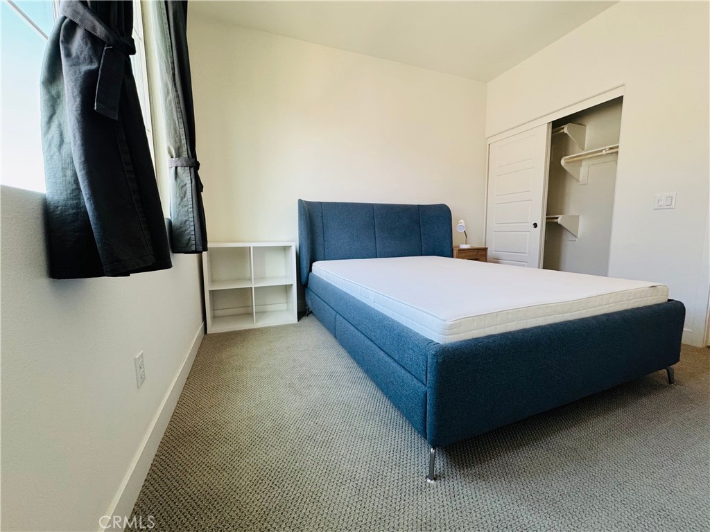 2626 Glamis Court Arcadia, CA 91007 - Photo 31 of 68 a large bed sitting in a bedroom next to a small yard