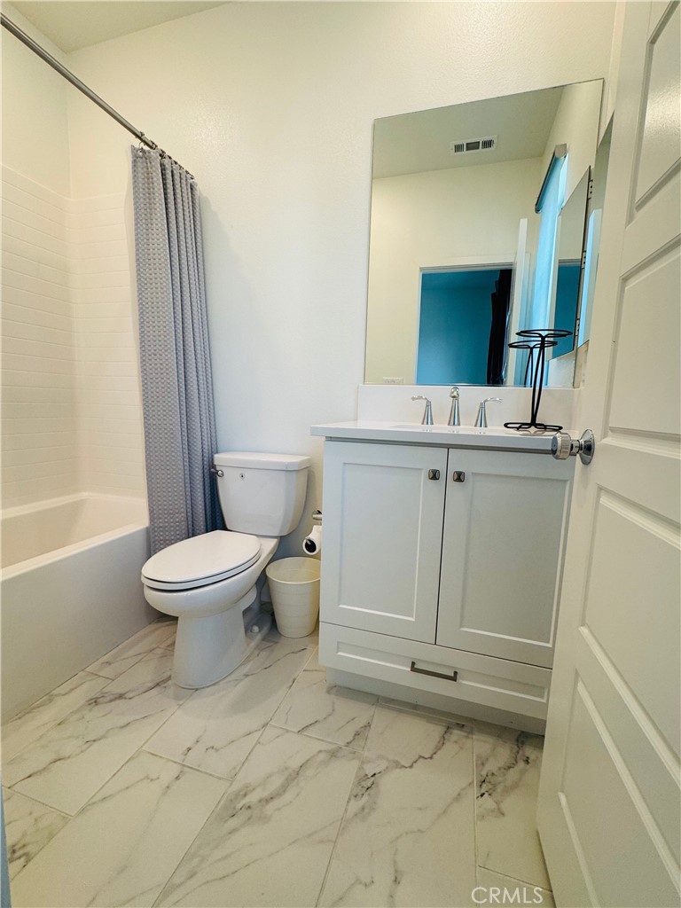 2626 Glamis Court Arcadia, CA 91007 - Photo 32 of 68 a bathroom with a toilet sink and a mirror