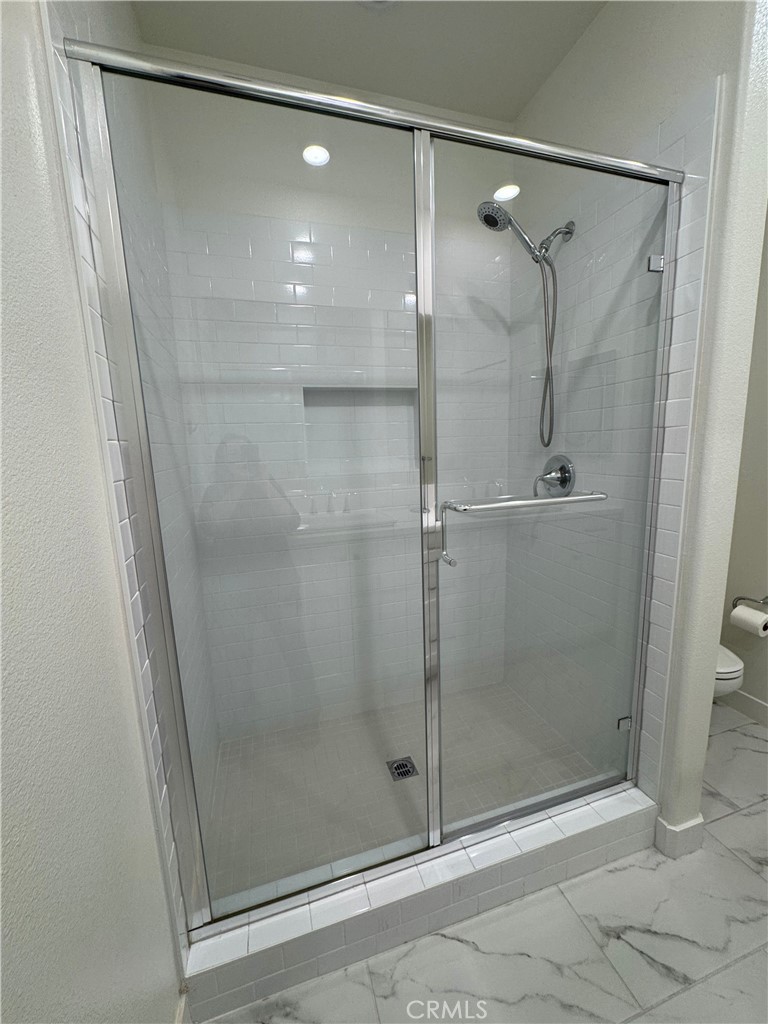 2626 Glamis Court Arcadia, CA 91007 - Photo 40 of 68 a bathroom with a glass door shower