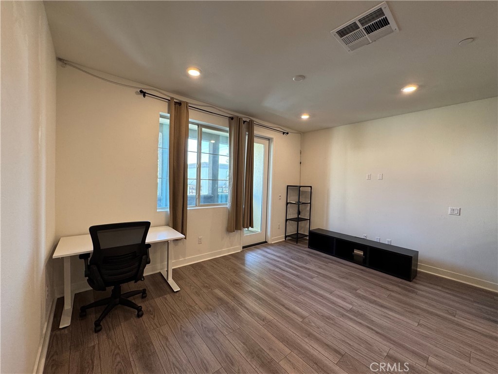 2626 Glamis Court Arcadia, CA 91007 - Photo 48 of 68 a view of workspace with wooden floor and lounge chair