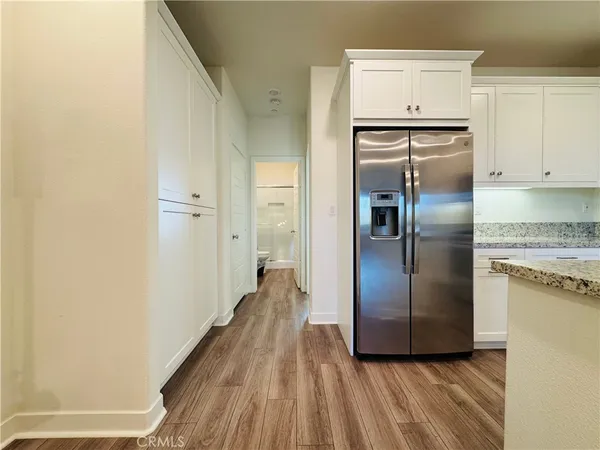 a bathroom with a toilet and a mirror