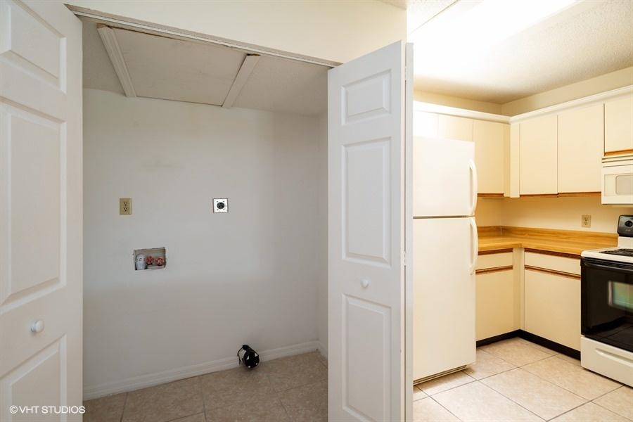 9013 Southeast Hobe Ridge Avenue Hobe Sound, FL 33455 - Photo 12 of 26 Laundry closet
