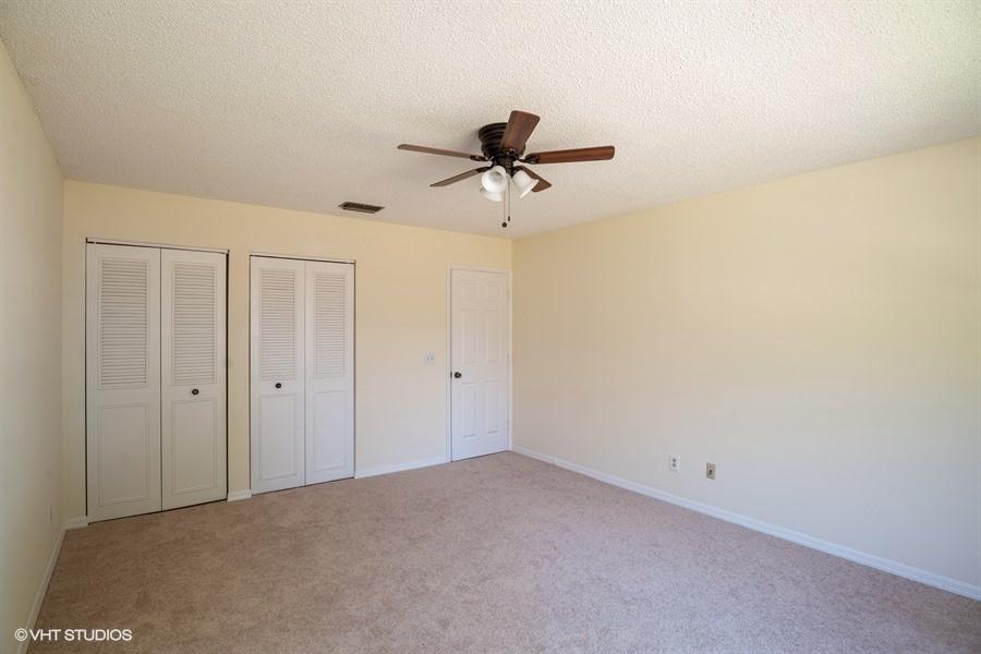 9013 Southeast Hobe Ridge Avenue Hobe Sound, FL 33455 - Photo 14 of 26 Master bedroom