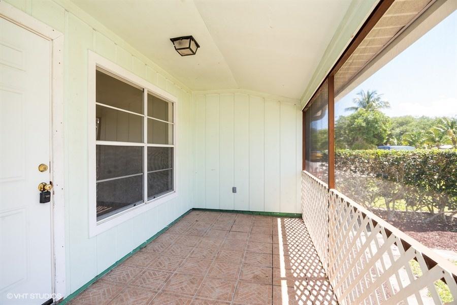 9013 Southeast Hobe Ridge Avenue Hobe Sound, FL 33455 - Photo 4 of 26 Front porch