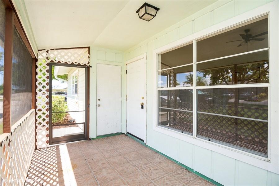 9013 Southeast Hobe Ridge Avenue Hobe Sound, FL 33455 - Photo 5 of 26 Froont porch