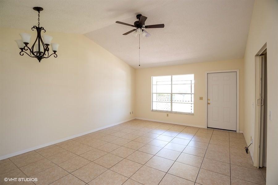 9013 Southeast Hobe Ridge Avenue Hobe Sound, FL 33455 - Photo 7 of 26 Living room and dining area