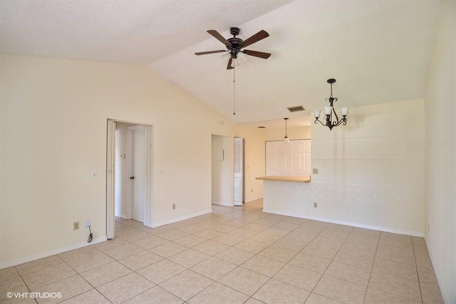 9013 Southeast Hobe Ridge Avenue Hobe Sound, FL 33455 - Photo 9 of 26 Living room and dining area
