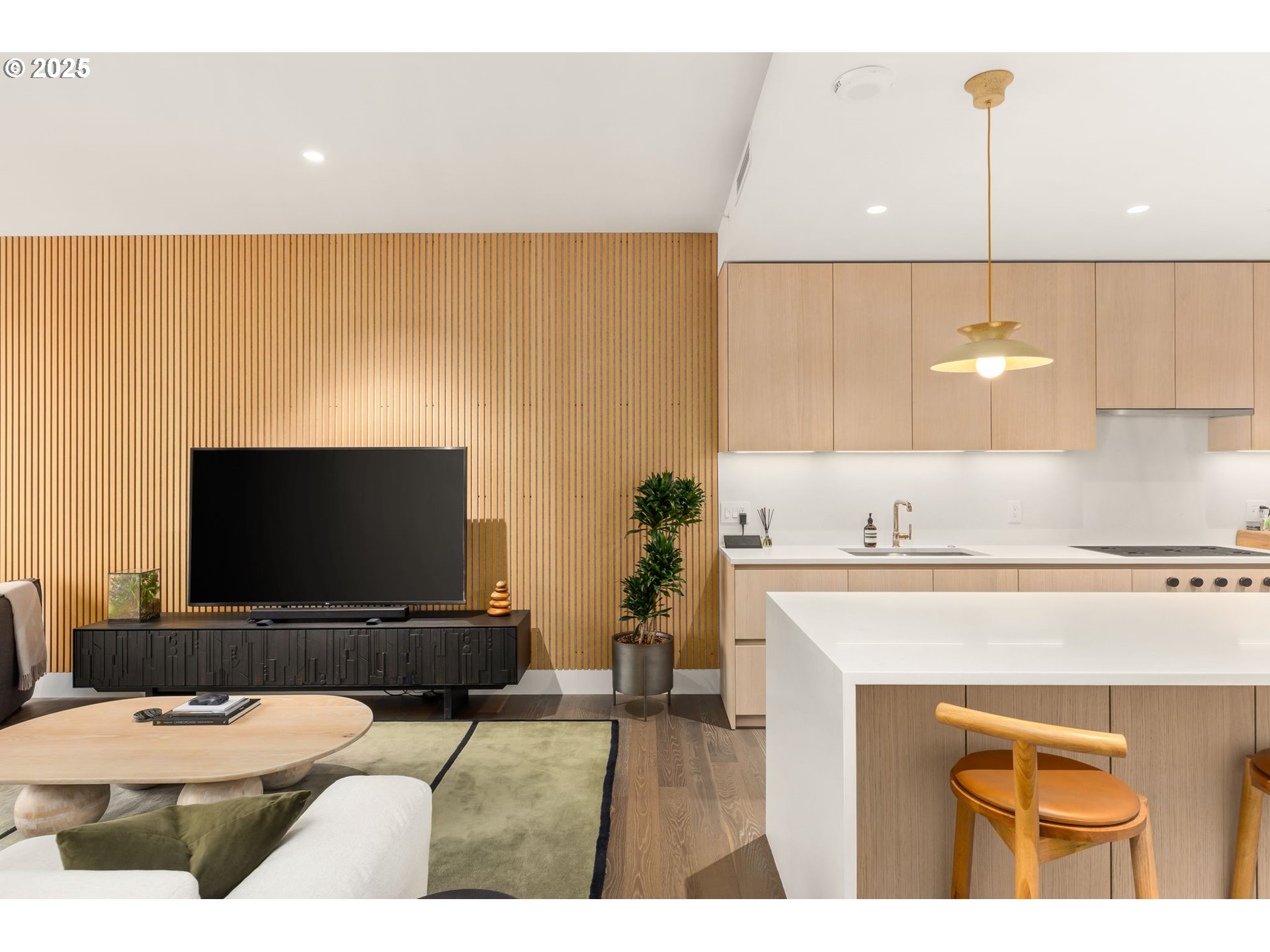 550 Southwest 10th Avenue, Unit 3003 Portland, OR 97205 - Photo 13 of 44 a living room with a flat screen tv and a table