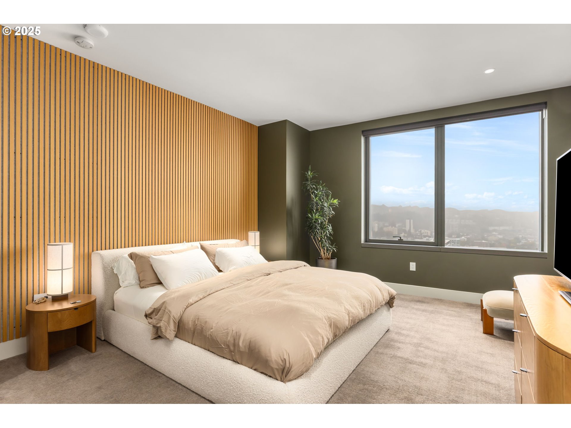 550 Southwest 10th Avenue, Unit 3003 Portland, OR 97205 - Photo 17 of 44 a bedroom with a large bed and a large window