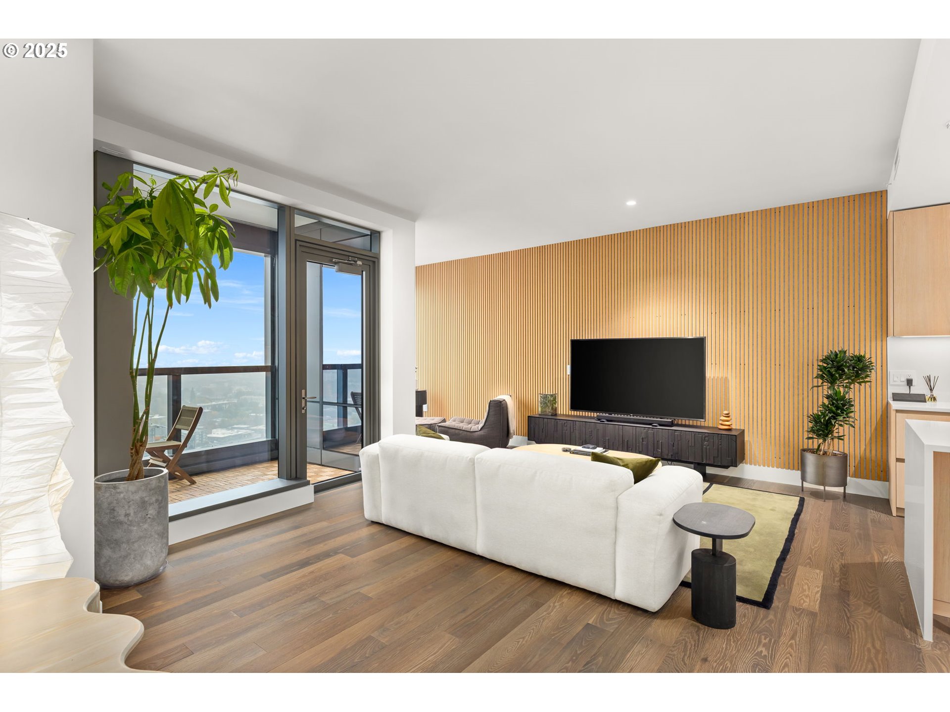 550 Southwest 10th Avenue, Unit 3003 Portland, OR 97205 - Photo 30 of 44 a living room with furniture and a flat screen tv