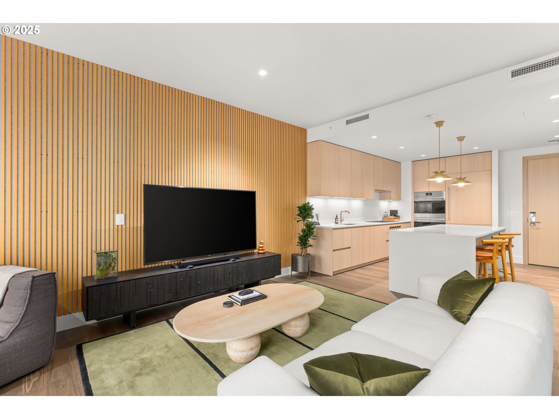 550 Southwest 10th Avenue, Unit 3003 Portland, OR 97205 - Photo 3 of 44 a living room with furniture and a flat screen tv