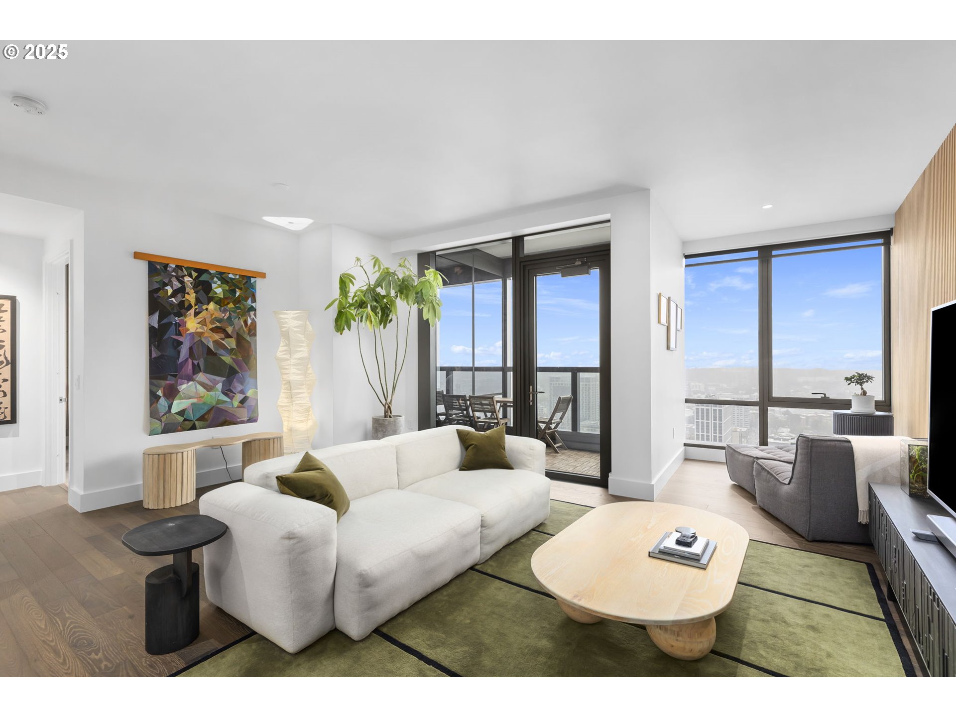 550 Southwest 10th Avenue, Unit 3003 Portland, OR 97205 - Photo 31 of 44 a living room with furniture a rug potted plant and a large window