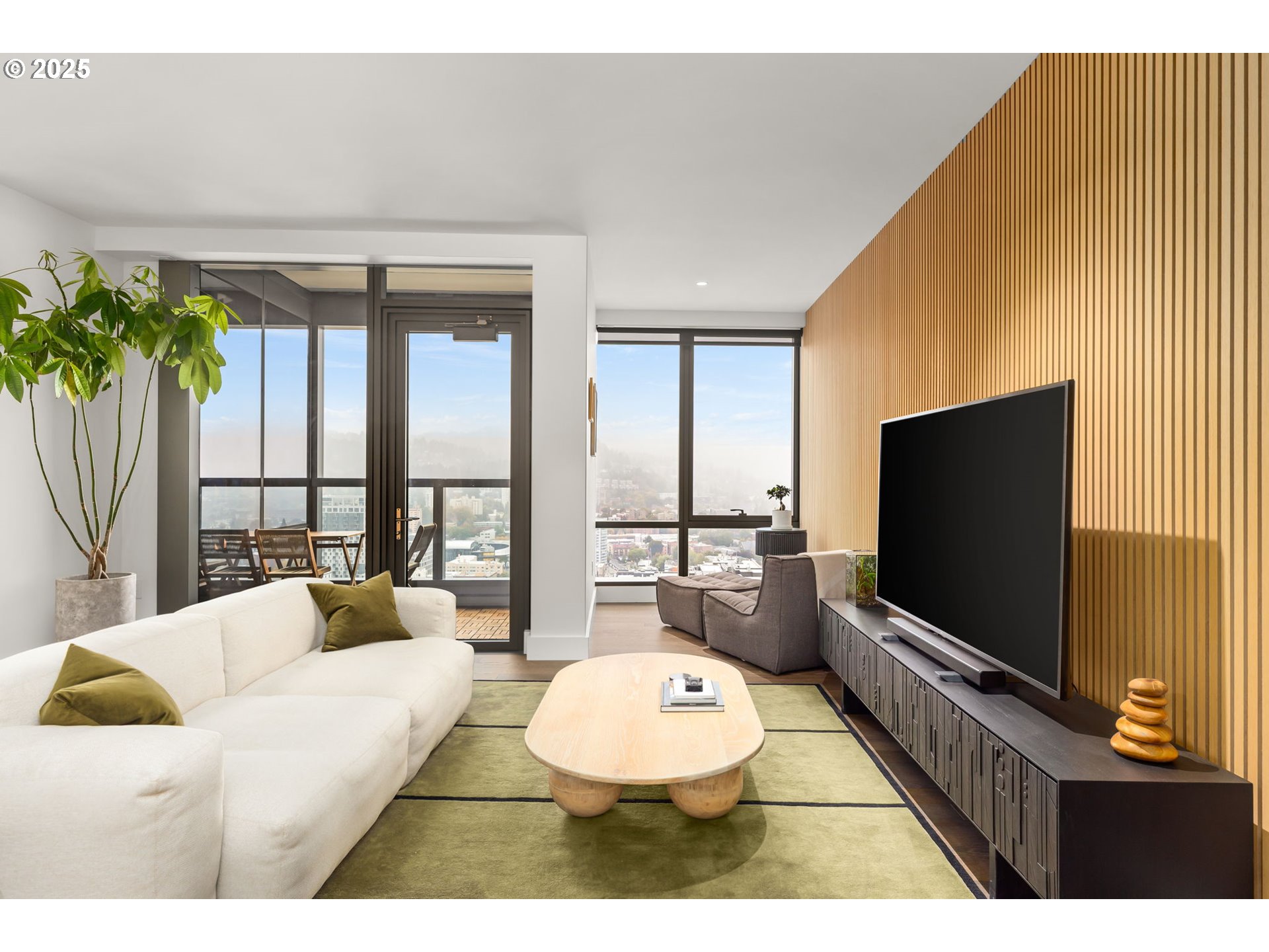 550 Southwest 10th Avenue, Unit 3003 Portland, OR 97205 - Photo 32 of 44 a living room with furniture and a flat screen tv