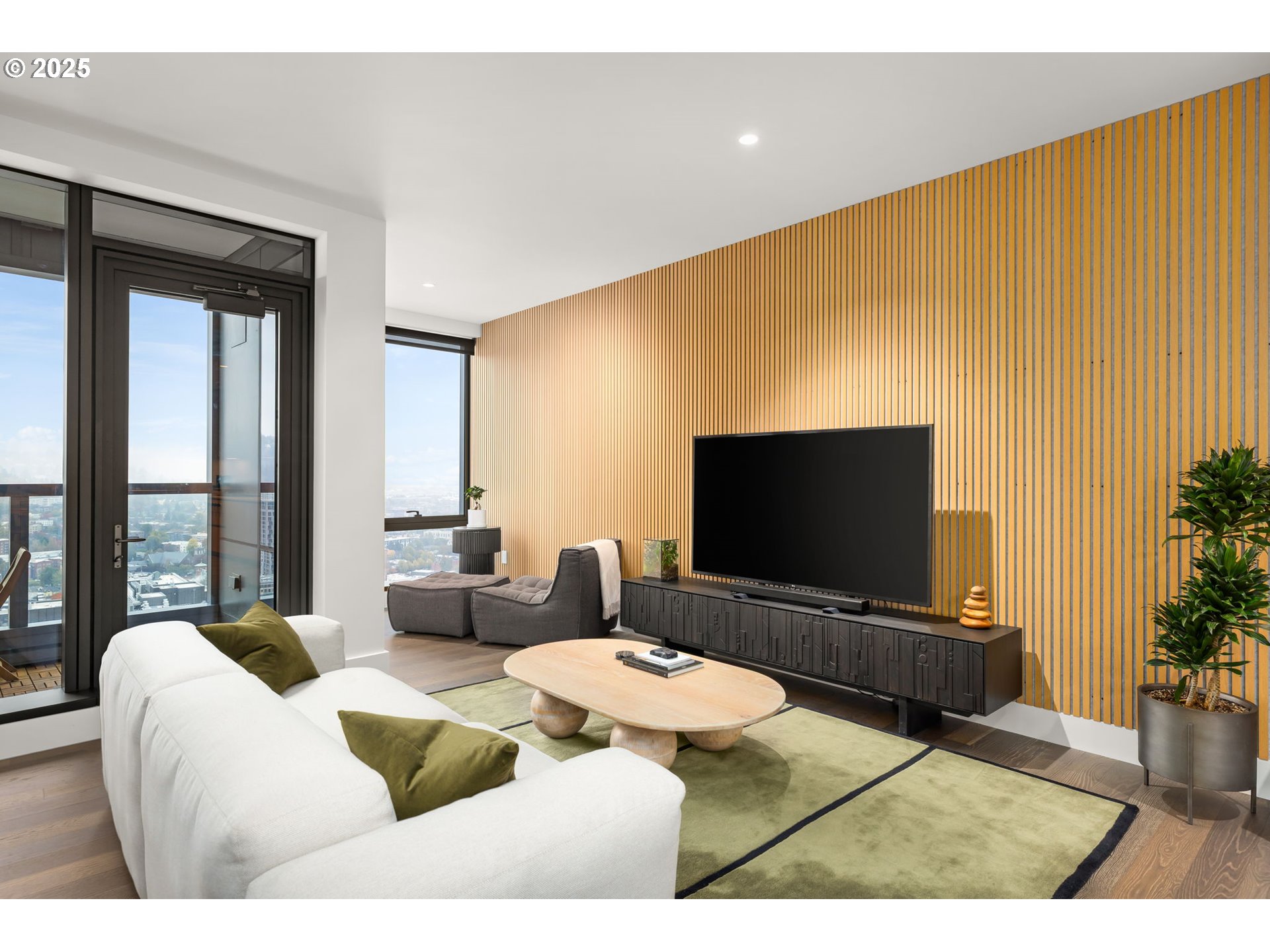 550 Southwest 10th Avenue, Unit 3003 Portland, OR 97205 - Photo 33 of 44 a living room with furniture and a flat screen tv