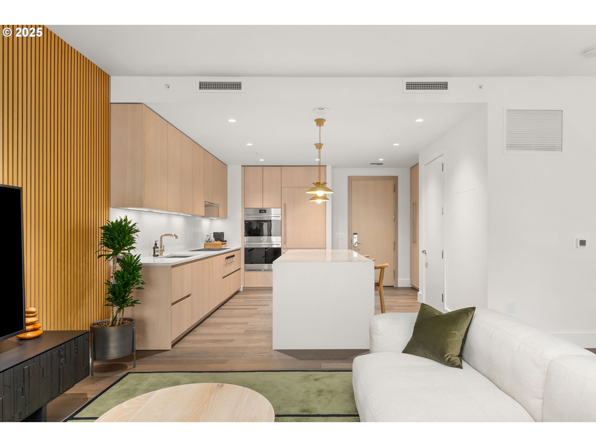550 Southwest 10th Avenue, Unit 3003 Portland, OR 97205 - Photo 4 of 44 a living room with stainless steel appliances kitchen island granite countertop furniture and a couch