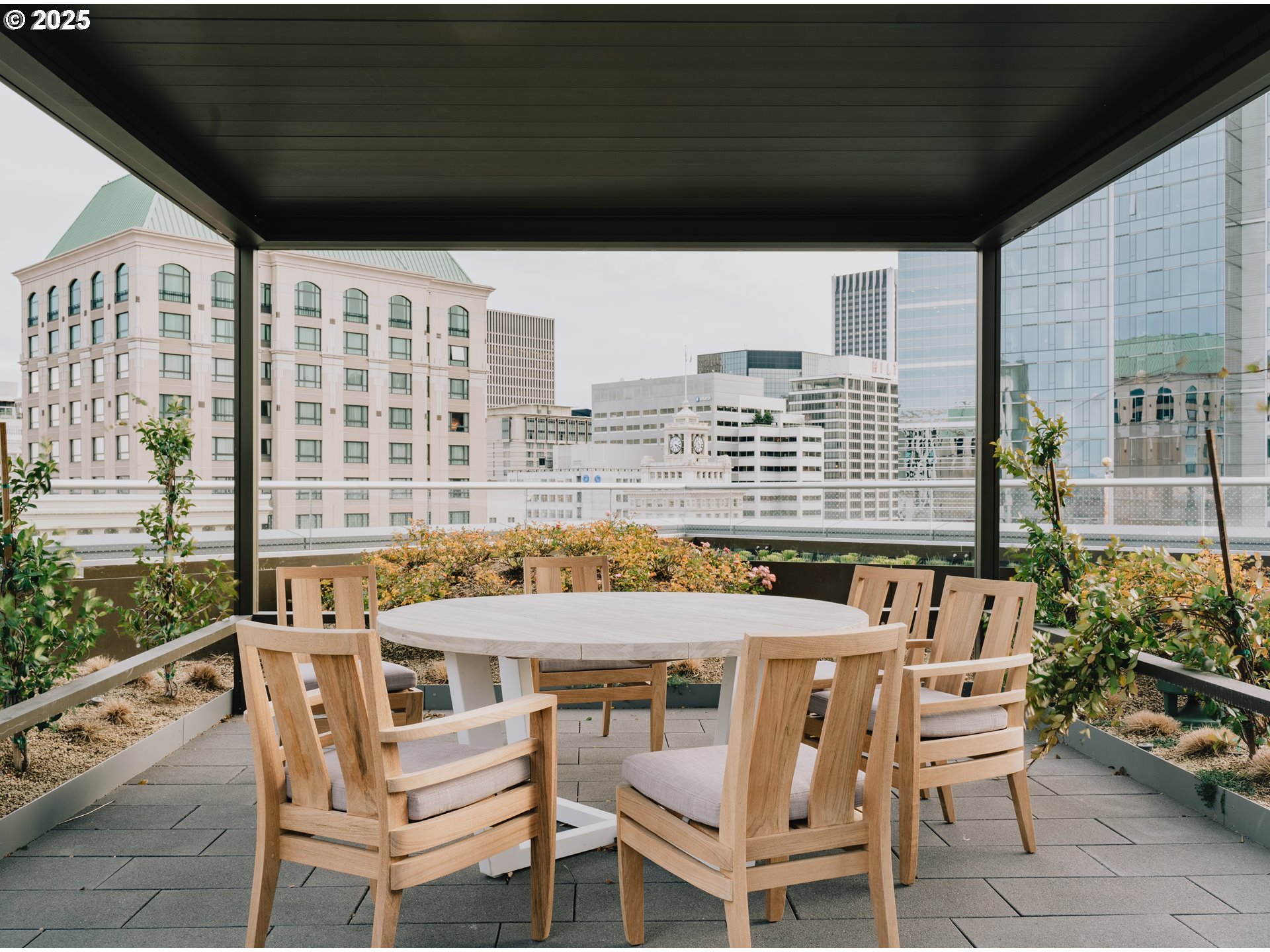 550 Southwest 10th Avenue, Unit 3003 Portland, OR 97205 - Photo 42 of 44 a balcony with table and chairs