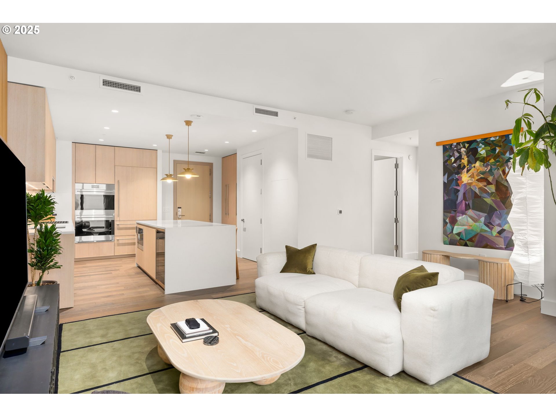 550 Southwest 10th Avenue, Unit 3003 Portland, OR 97205 - Photo 5 of 44 a living room with furniture and a couch