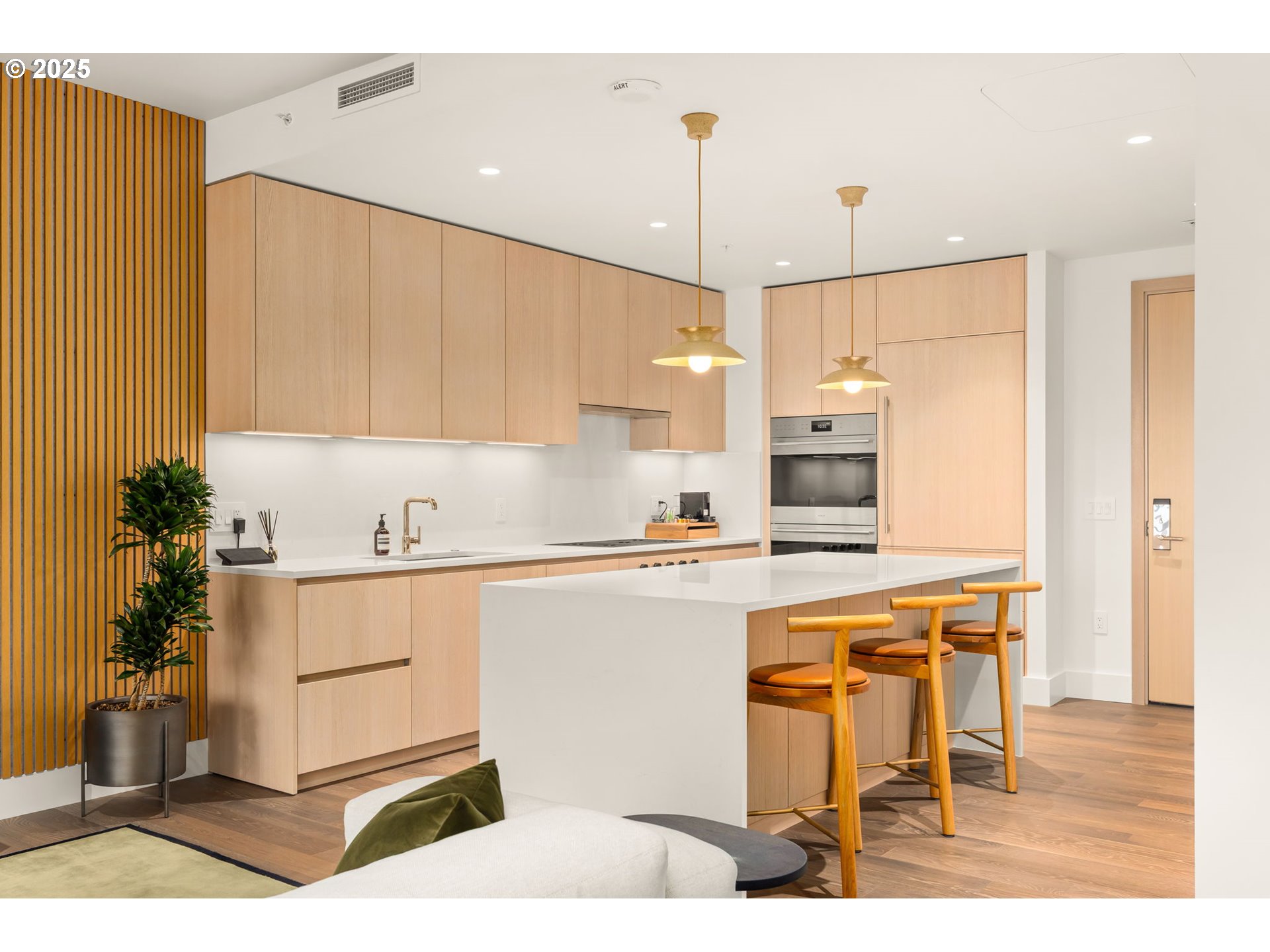 550 Southwest 10th Avenue, Unit 3003 Portland, OR 97205 - Photo 7 of 44 a kitchen with a table chairs refrigerator and microwave