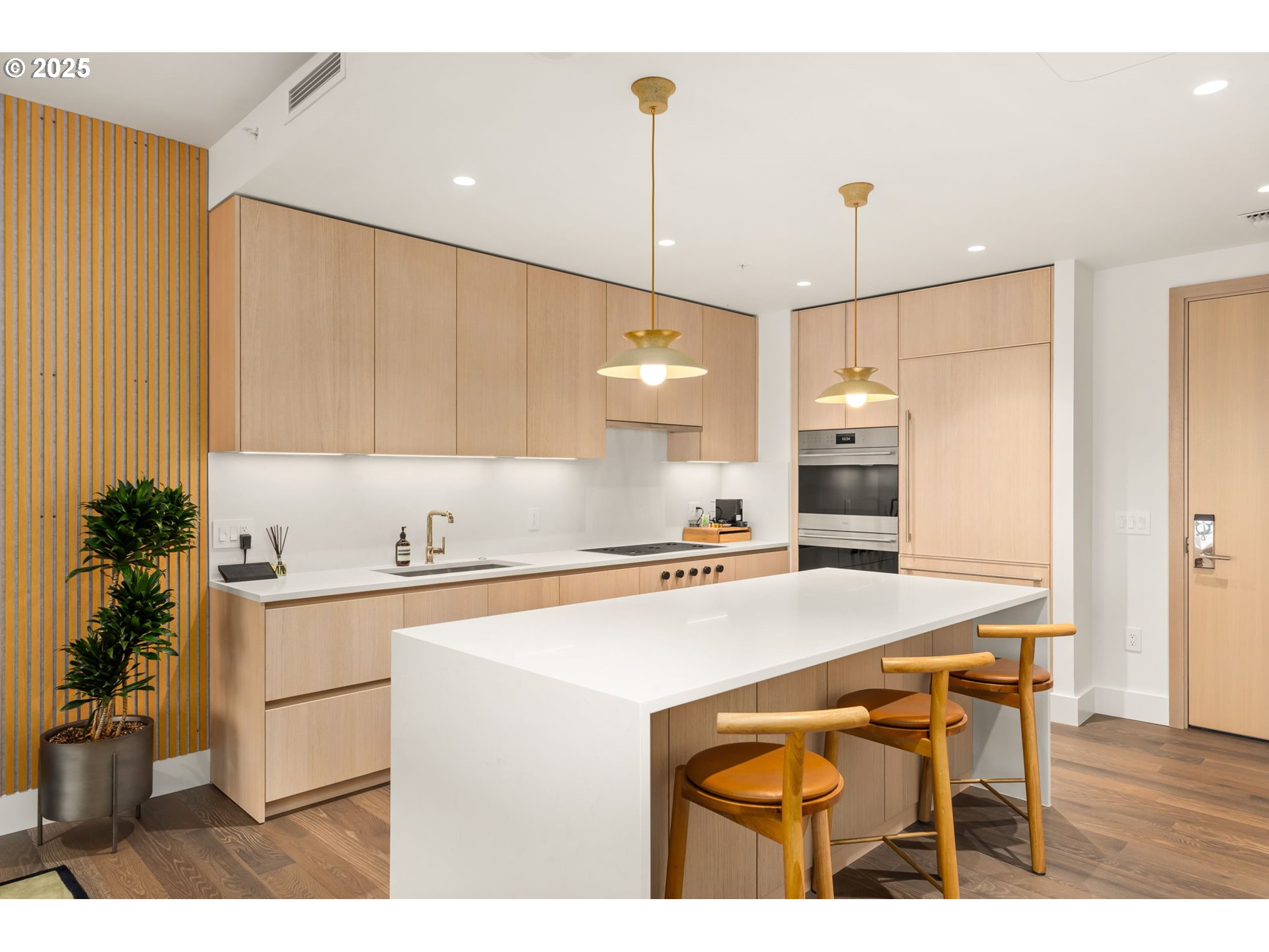550 Southwest 10th Avenue, Unit 3003 Portland, OR 97205 - Photo 8 of 44 a kitchen with a sink a stove a refrigerator and cabinets
