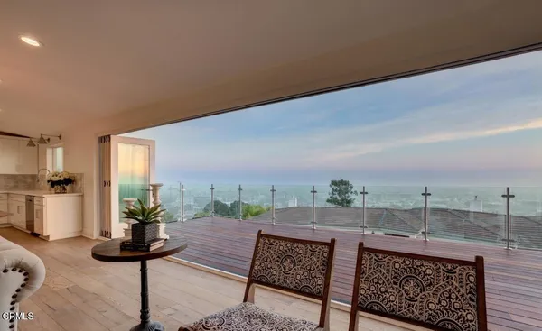 a view of a terrace with furniture and a table