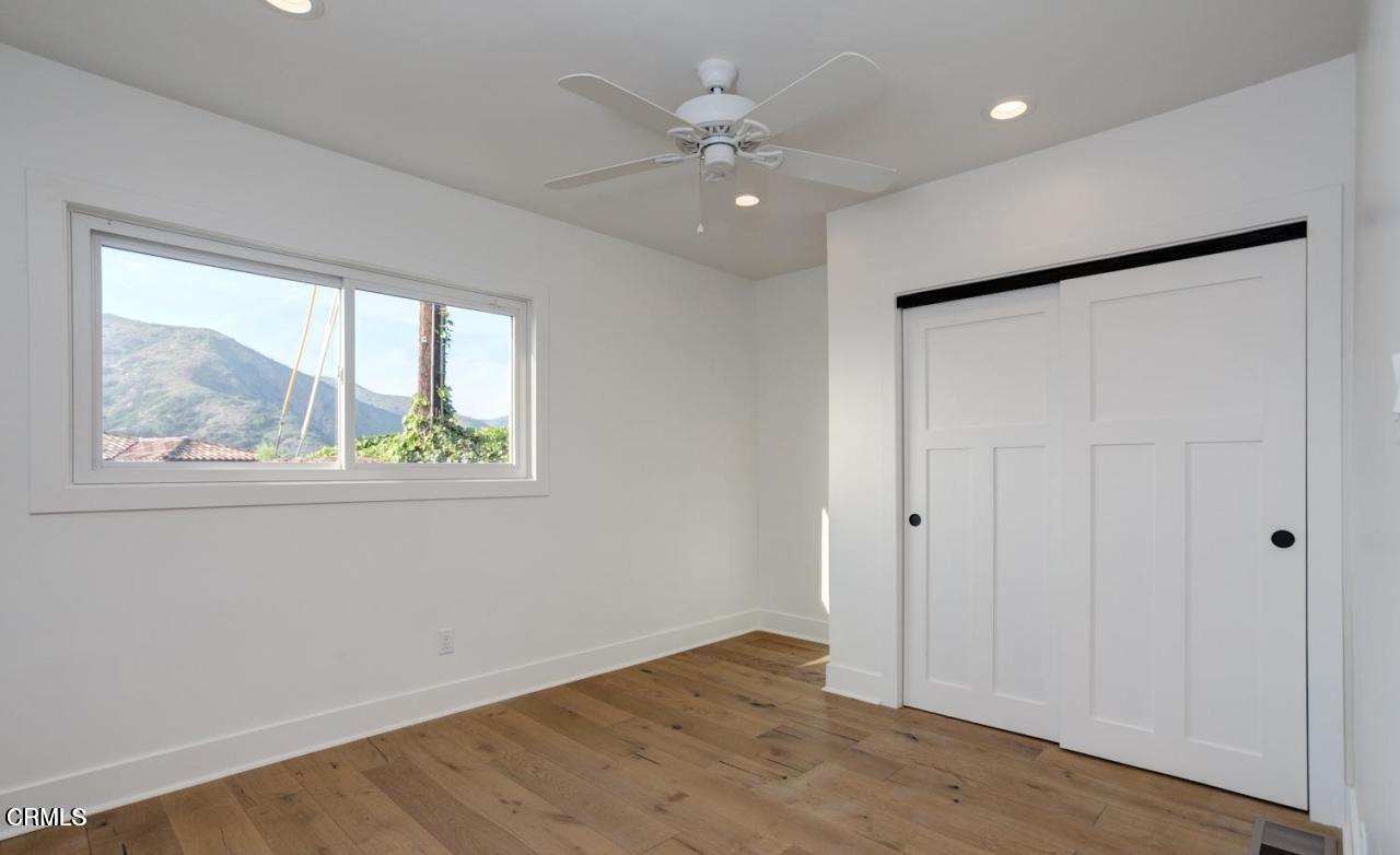 3026 Hilltop Drive Ventura, CA 93003 - Photo 13 of 31 wooden floor in an empty room with a window