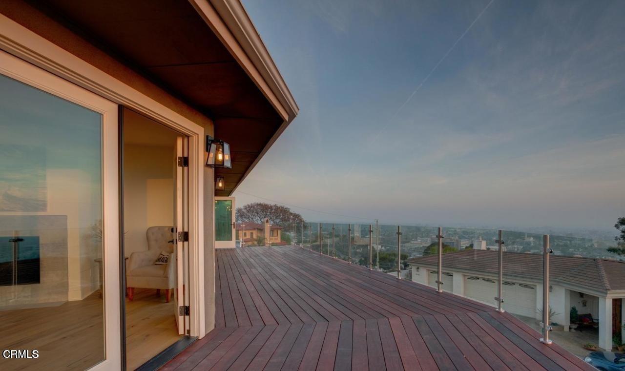 3026 Hilltop Drive Ventura, CA 93003 - Photo 16 of 31 a view of a balcony with wooden floor and fence