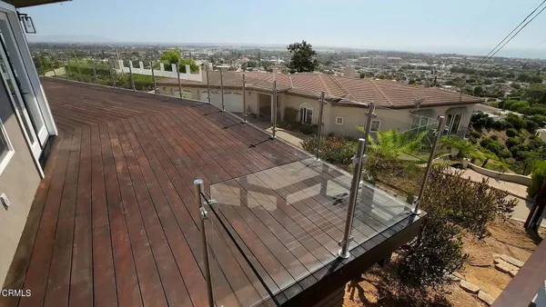 a view of a house with a backyard and sitting area