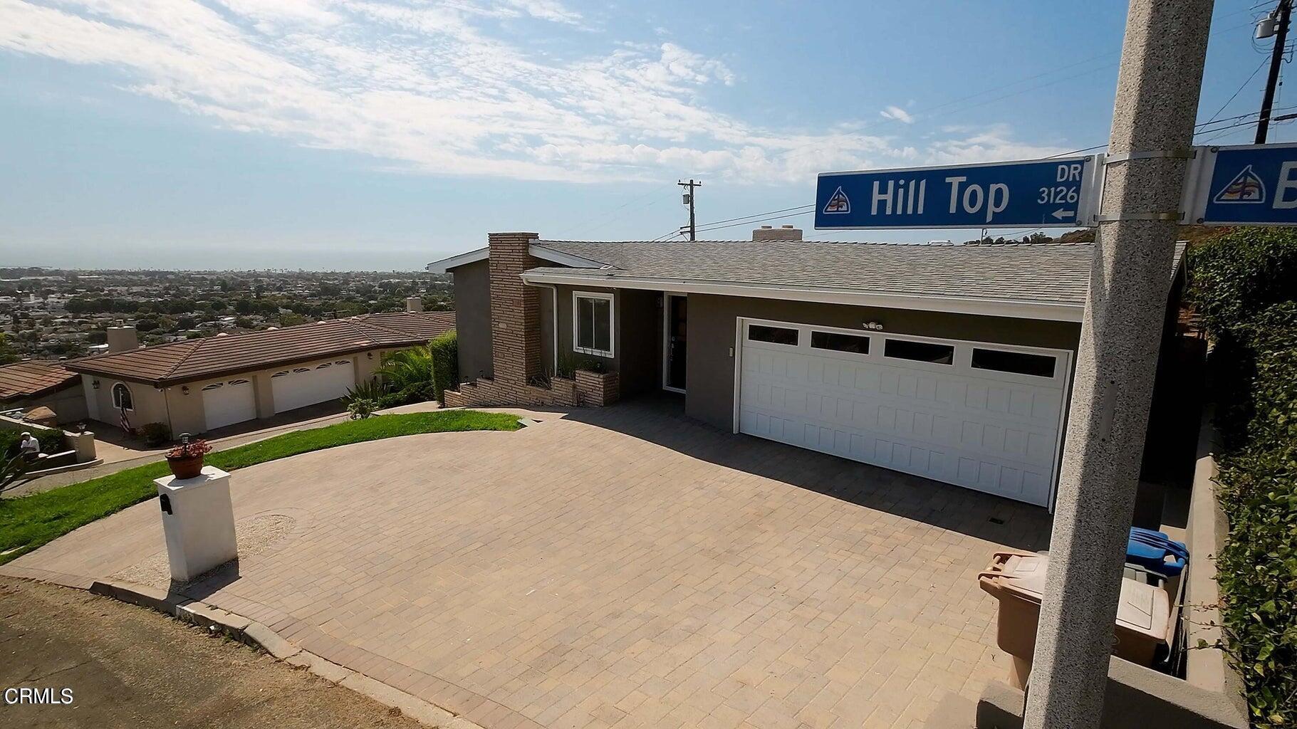 3026 Hilltop Drive Ventura, CA 93003 - Photo 21 of 31 a terrace with a table and chairs