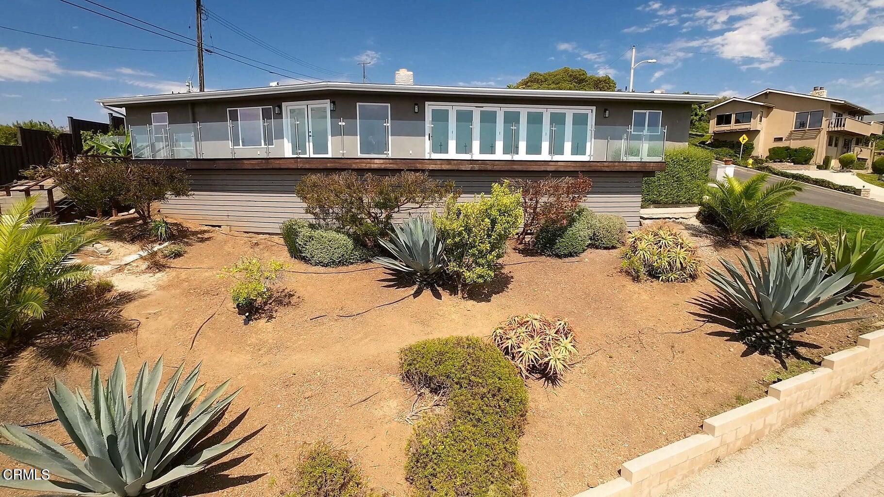 3026 Hilltop Drive Ventura, CA 93003 - Photo 22 of 31 a front view of a house with a yard