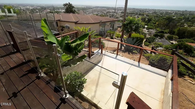 a view of a balcony with wooden floor