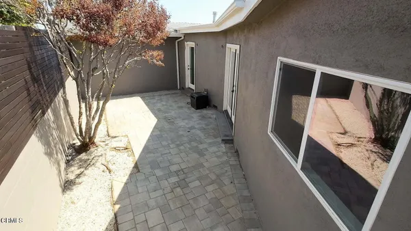 a backyard of a house with seating space