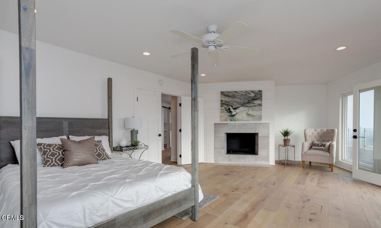 3026 Hilltop Drive Ventura, CA 93003 - Photo 8 of 31 a bedroom with a bed and a fireplace