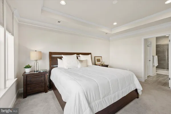 a bedroom with a bed and a lamp