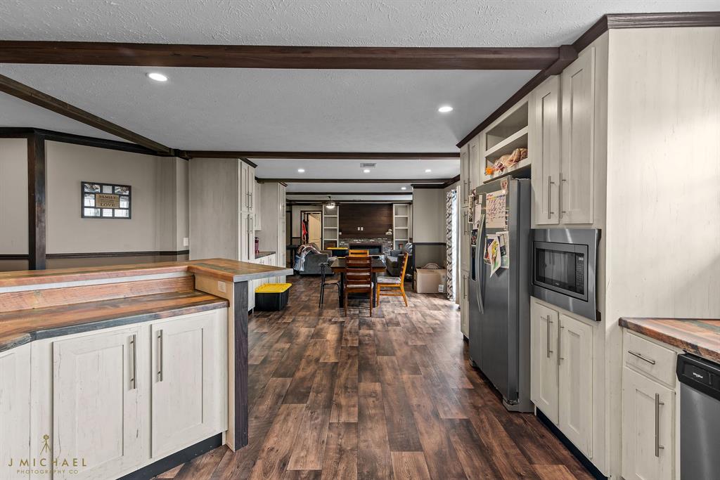4638 Benton Road Bossier City, LA 71111 - Photo 16 of 34 a kitchen with stainless steel appliances granite countertop a stove and a refrigerator