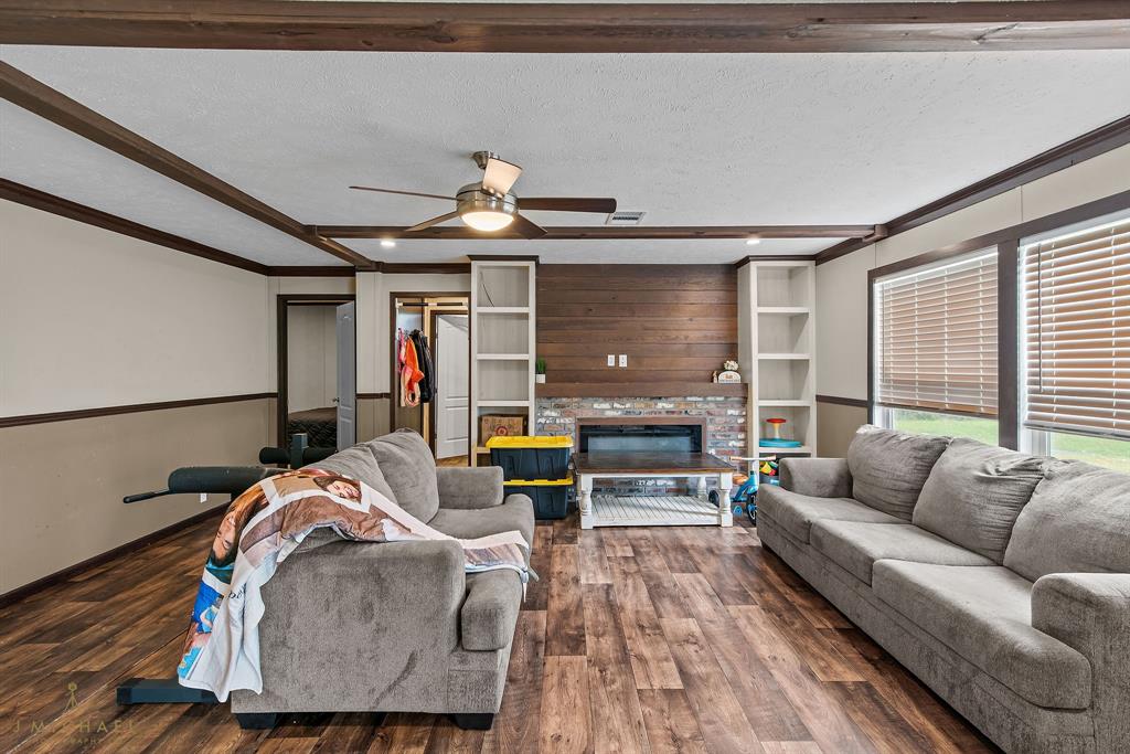 4638 Benton Road Bossier City, LA 71111 - Photo 18 of 34 a living room with furniture and a wooden floor