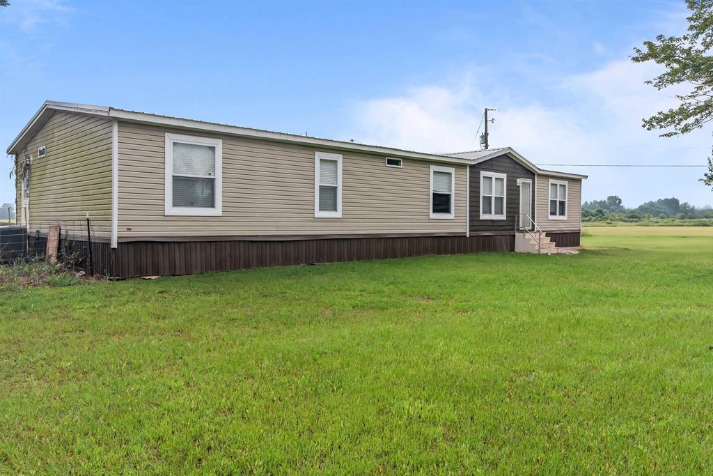 4638 Benton Road Bossier City, LA 71111 - Photo 2 of 34 a front view of a house with garden