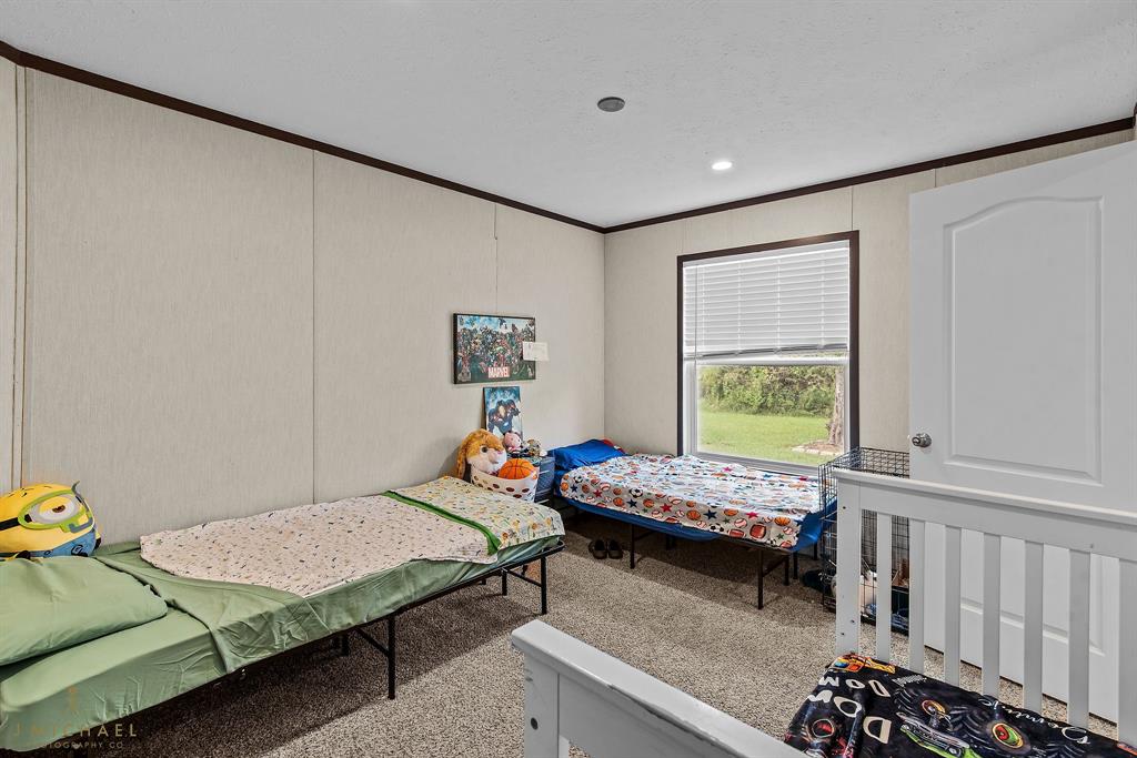 4638 Benton Road Bossier City, LA 71111 - Photo 23 of 34 a bedroom with furniture and a window