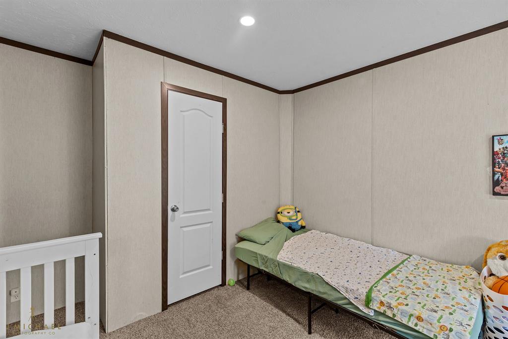 4638 Benton Road Bossier City, LA 71111 - Photo 24 of 34 a bedroom with a bed and a window