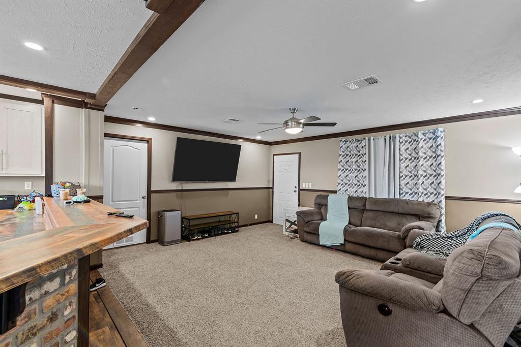 4638 Benton Road Bossier City, LA 71111 - Photo 9 of 34 a living room with furniture and a flat screen tv